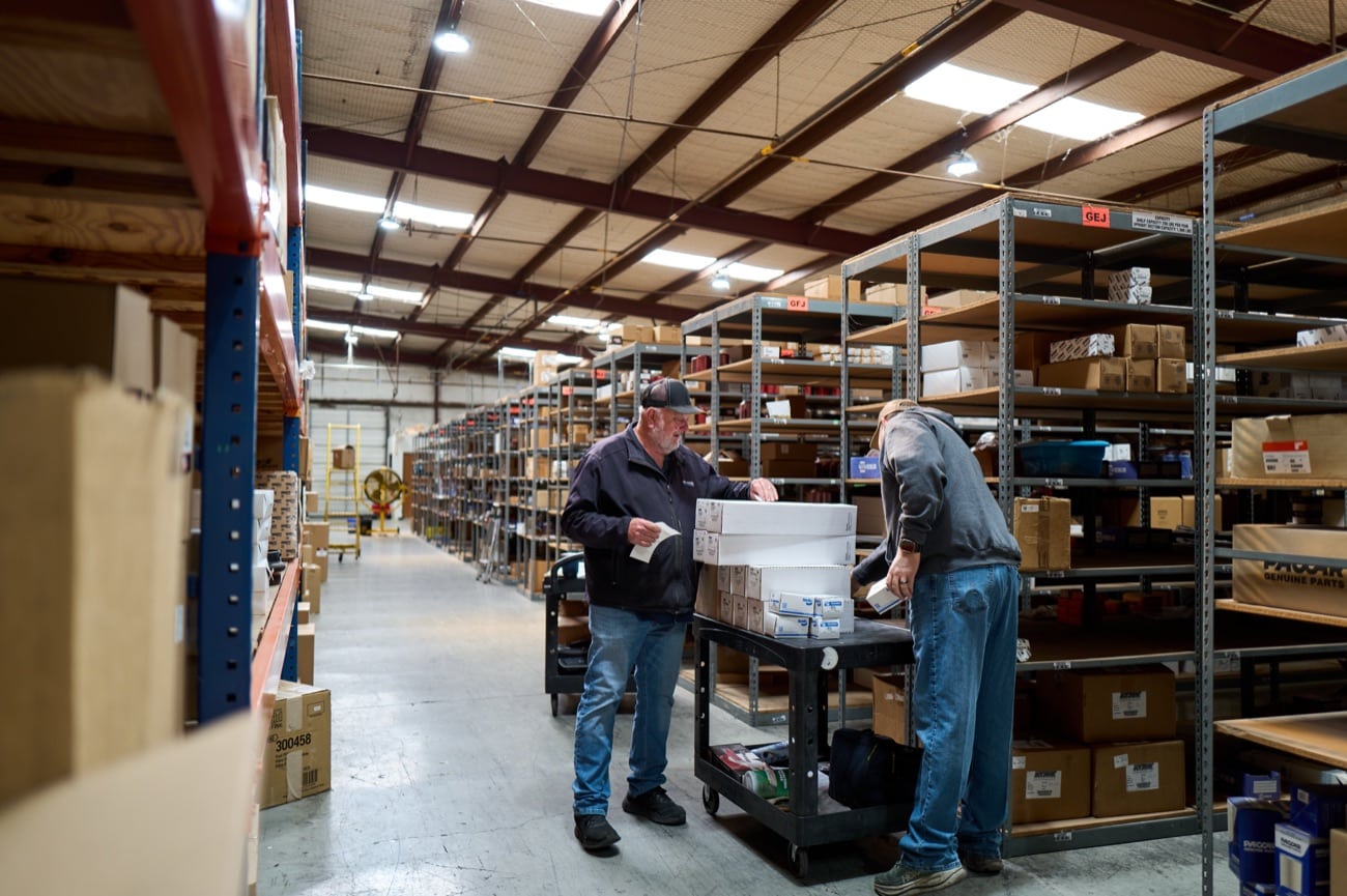Mi-Sher team working a warehouse aisle